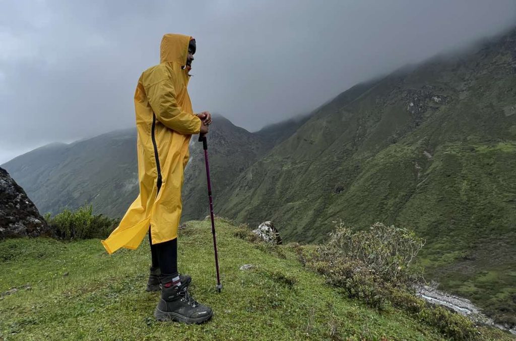 A trekker with right clothing, stick and shoes with correct preparation tips for trekking